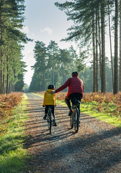 Father and daughter riding bikes
