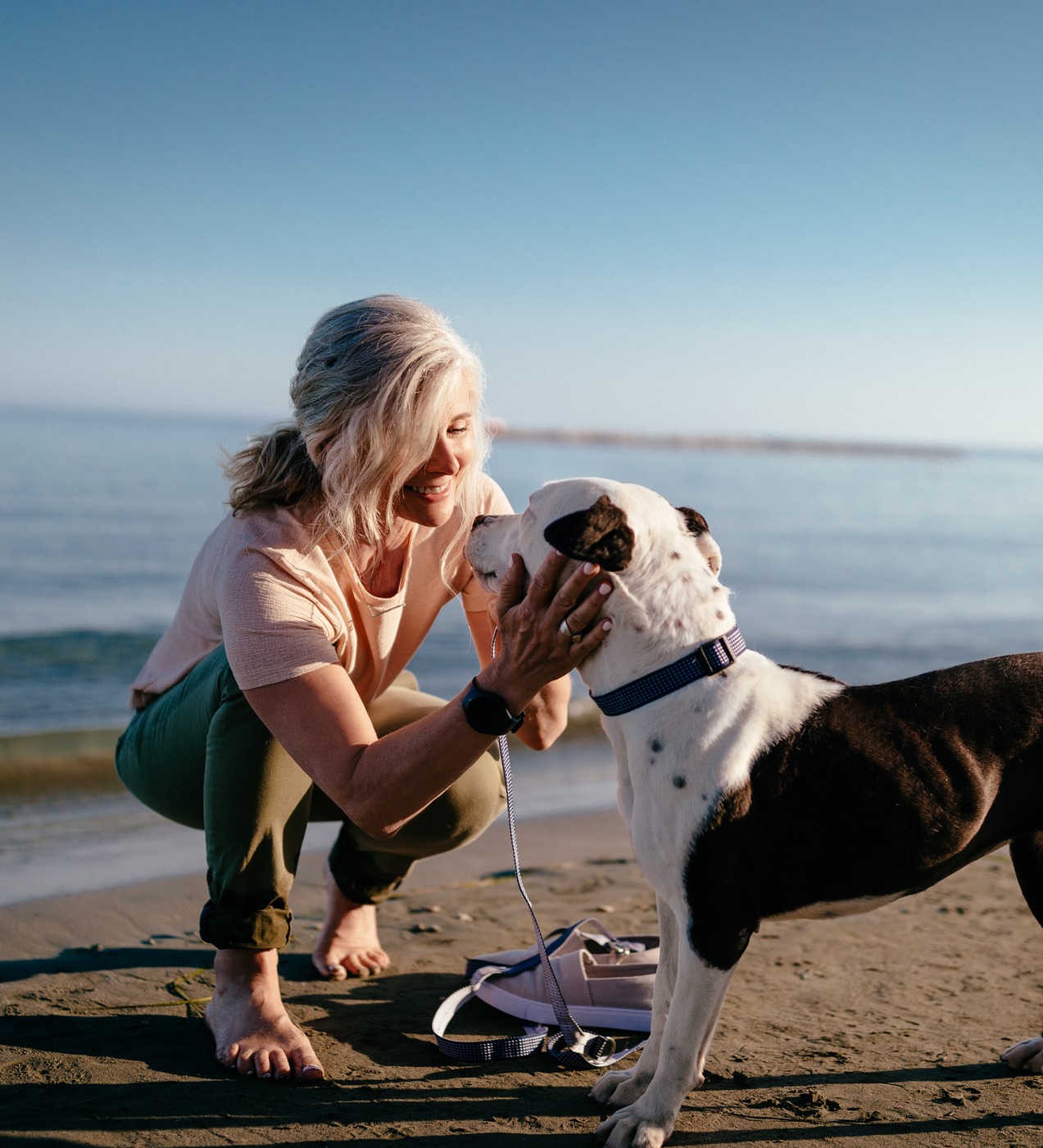 Woman with Dog on beach