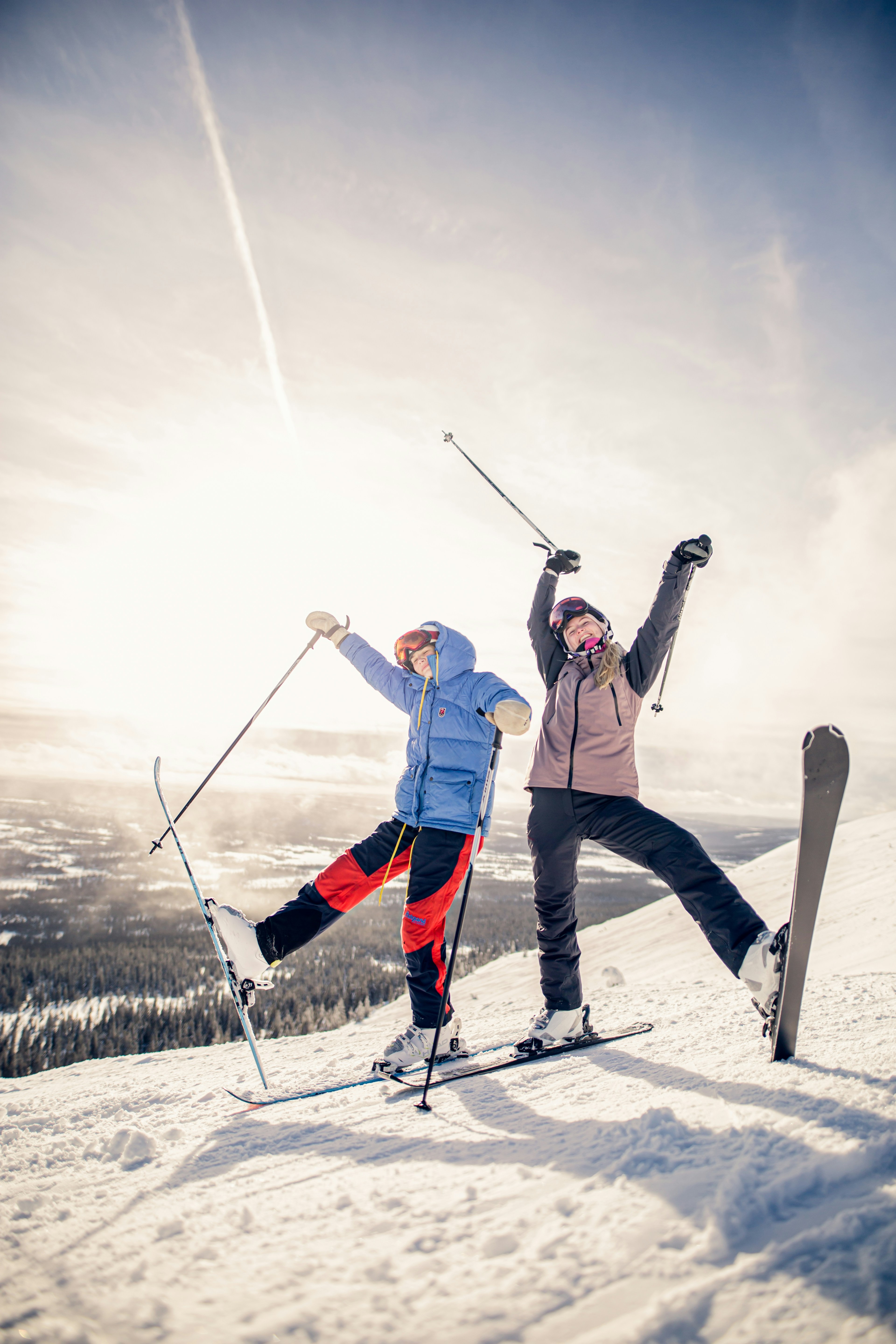 Two people having fun and posing in ski gear