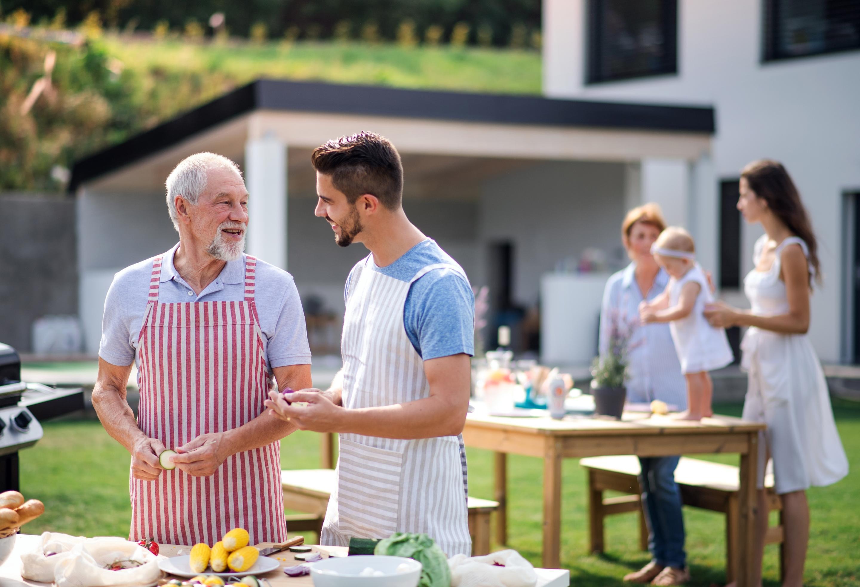 2 Men Talking at Family Picnic