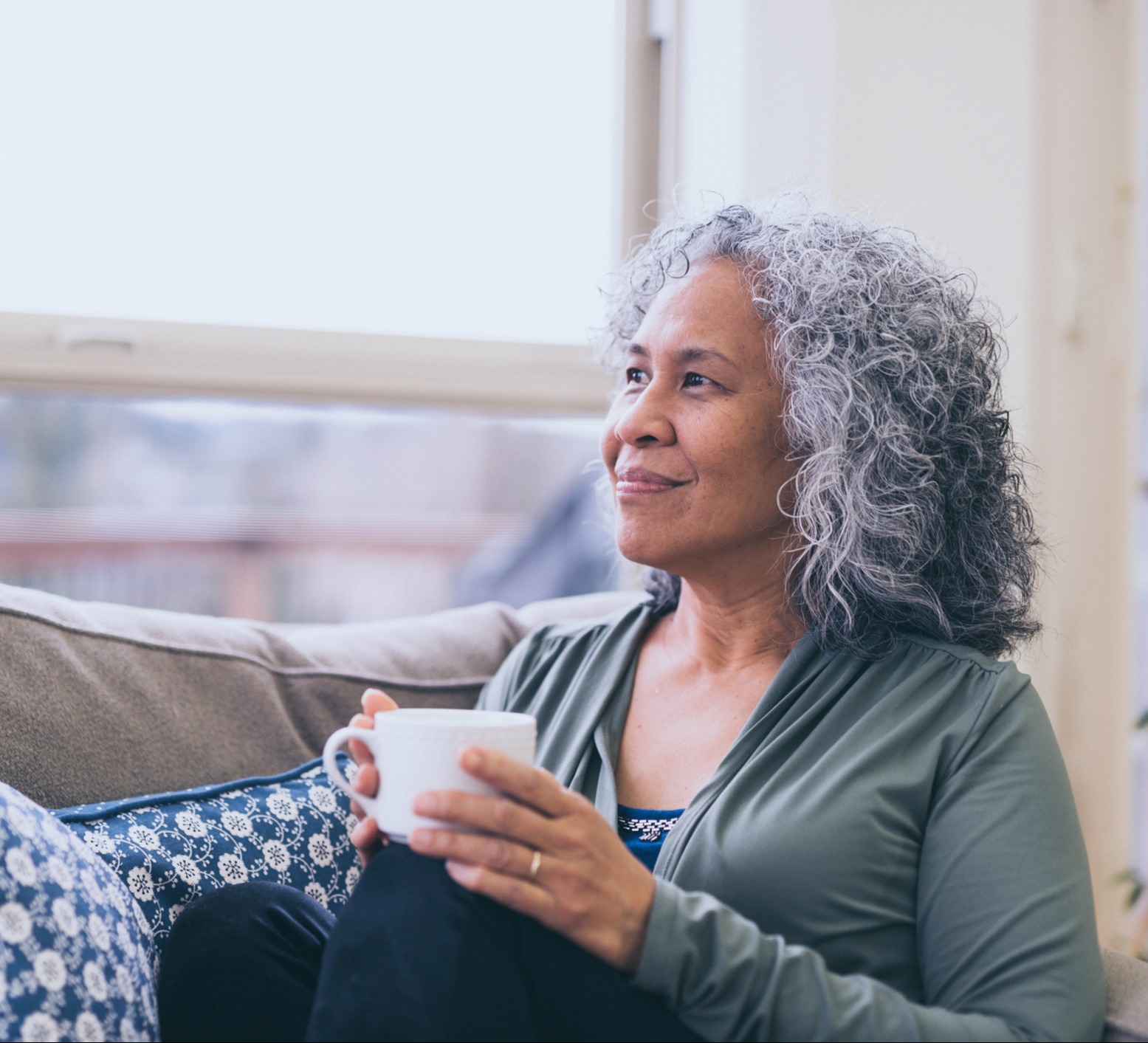 Older woman holding coffee cup