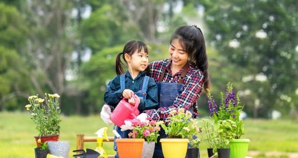 woman and young girl gardening