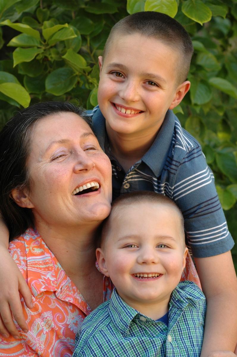 Grandmother laughing with her two grandsons