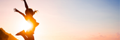 Girl jumping during sunset
