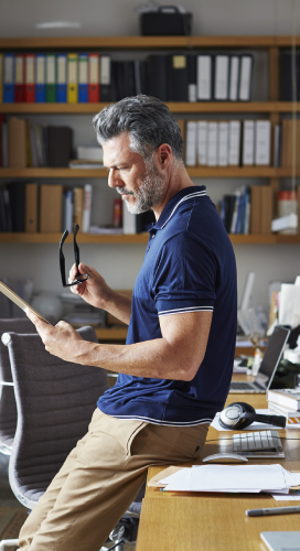 man working on an ipad in an office