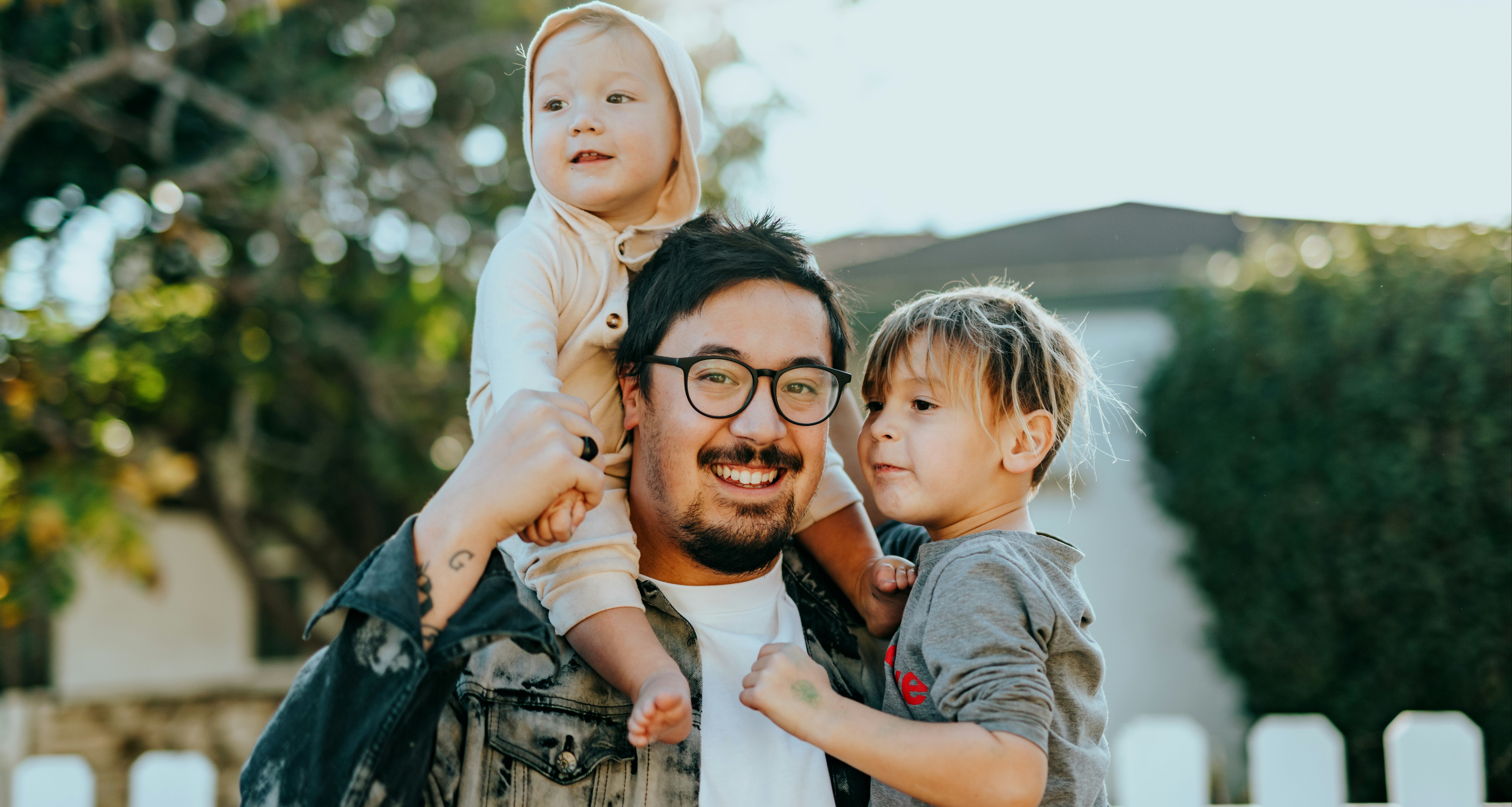 two people enjoying the outdoors with a child