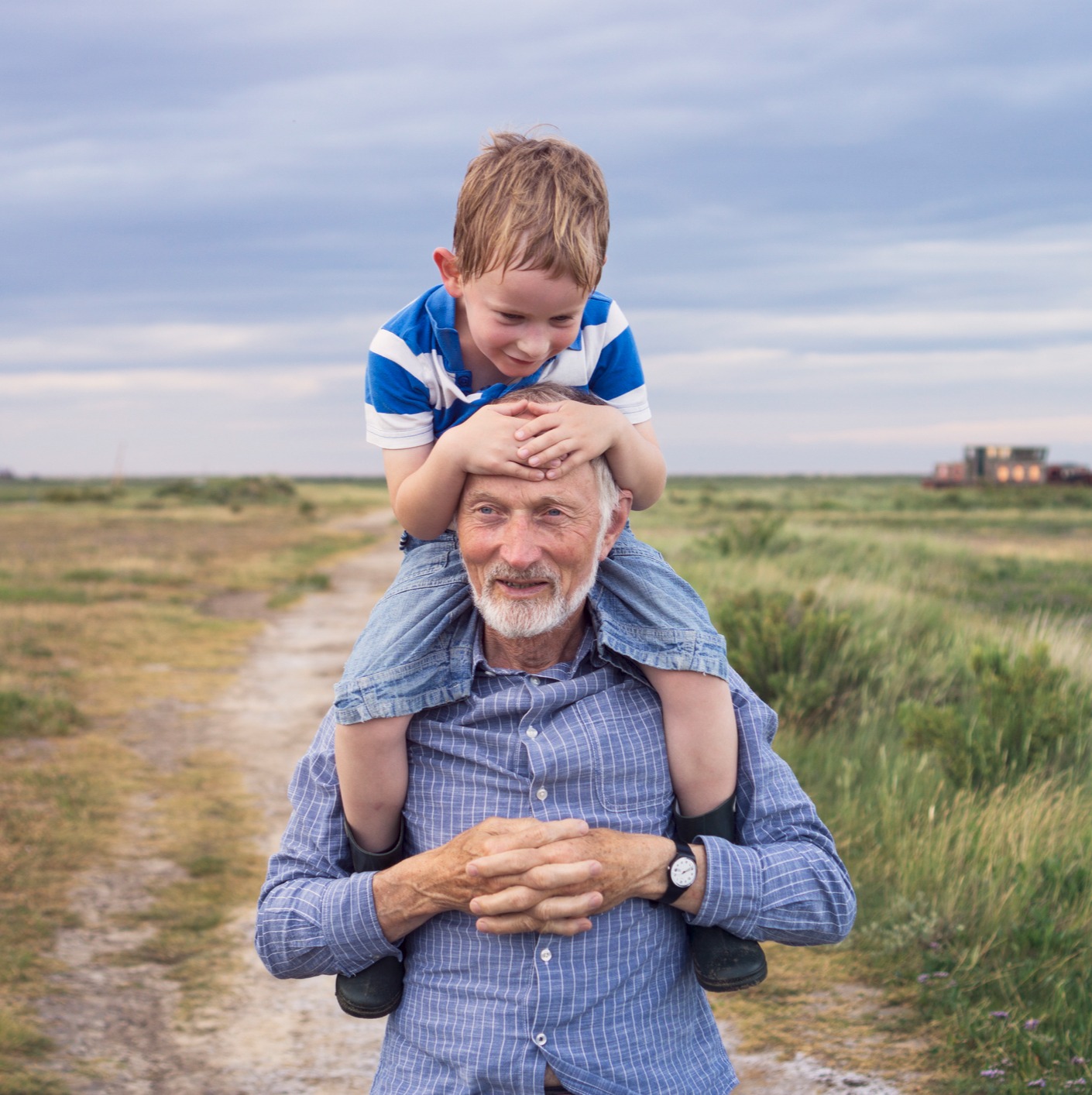 Outdoors - Grandfather with grandson on his shoulders