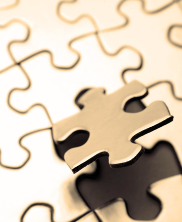 Puzzle Piece Floating out of Puzzle