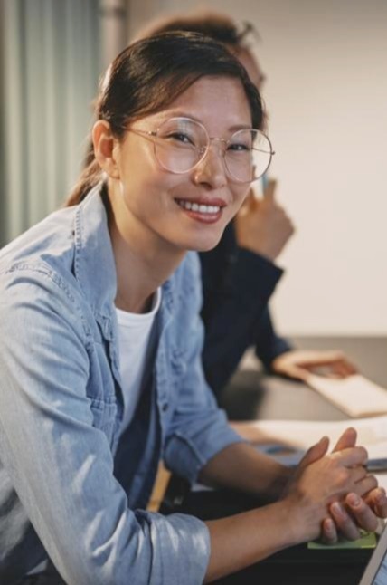 Woman in a business meeting smiling