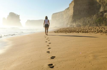Woman-walking-on-a-beach