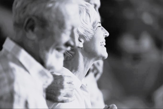 side profile of couple looking towards the sun