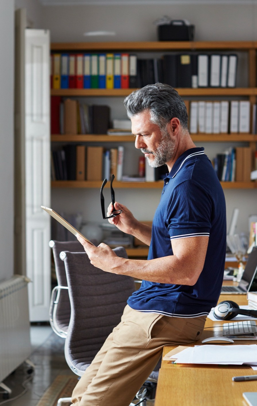 Mature man working in office
