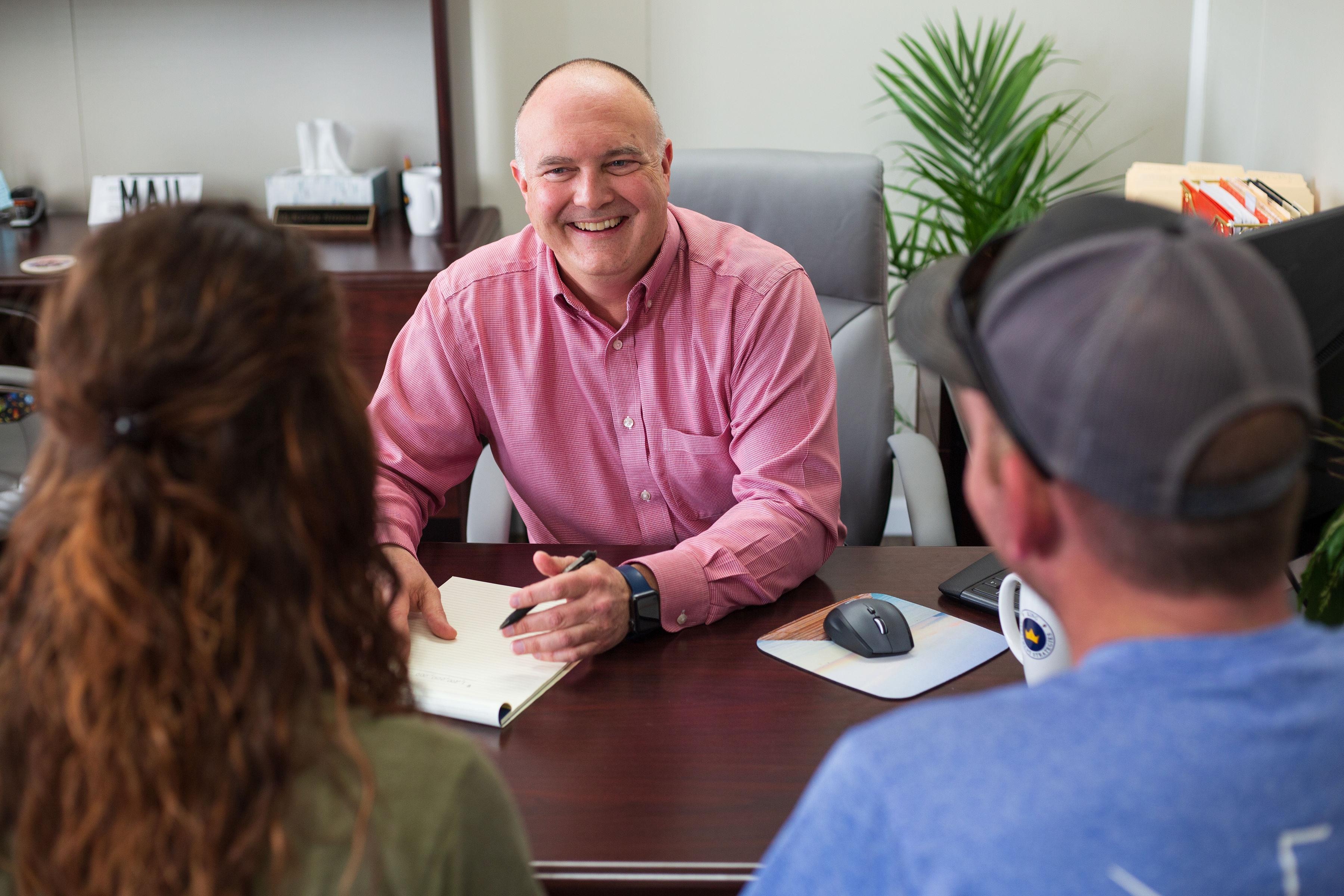 Advisor talking to clients