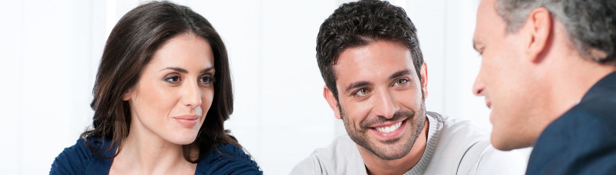Couple meeting with their financial advisor.
