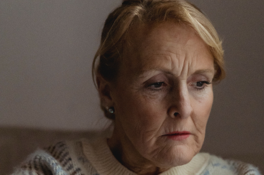 Somber-elderly-woman