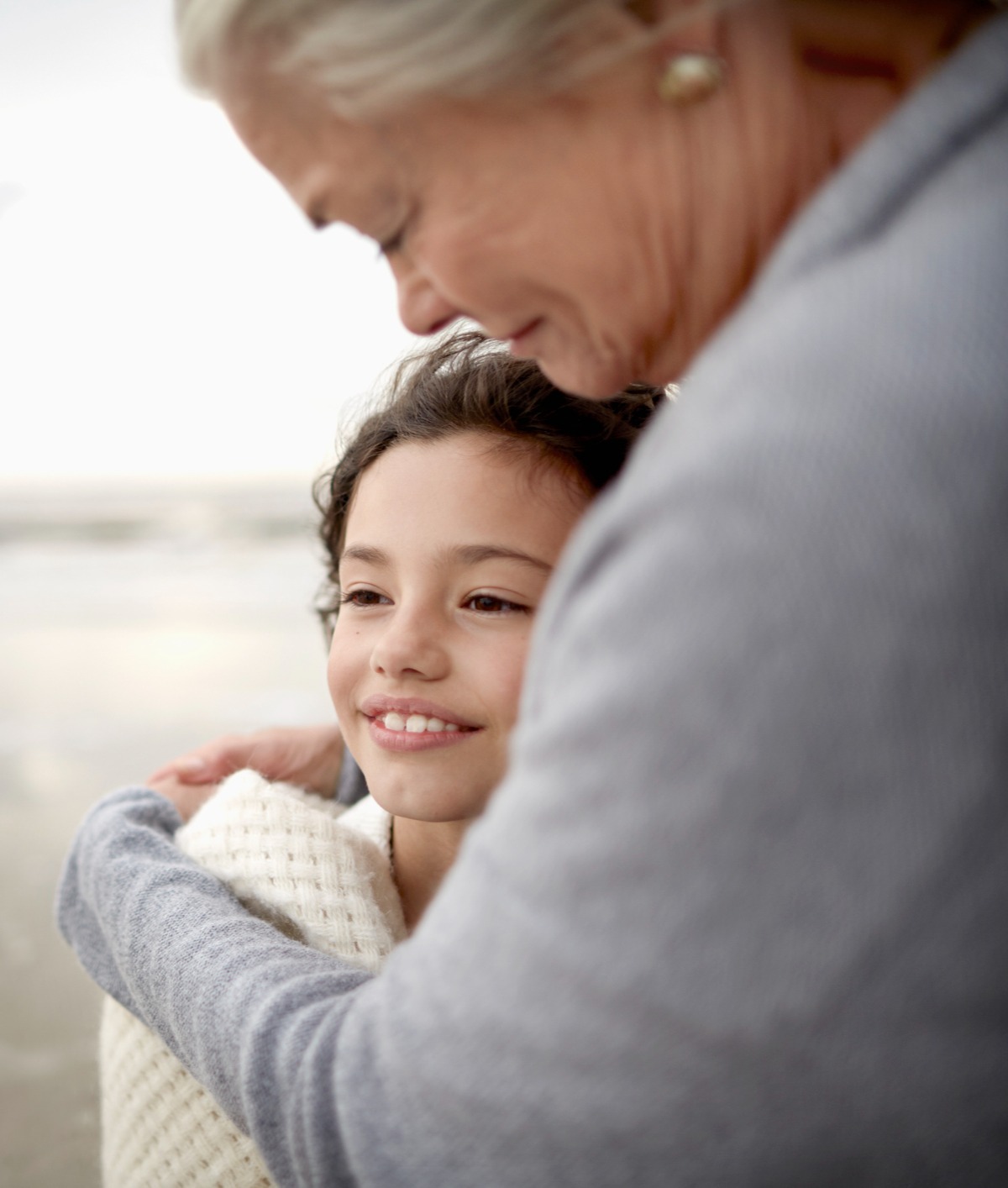 Granmother hugging her granddaughter
