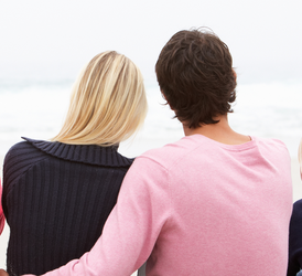 A couple sitting and embracing
