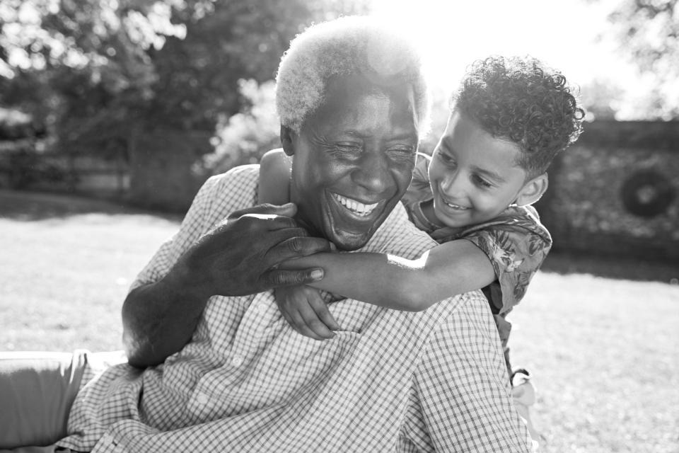 Elderly man playing with a child