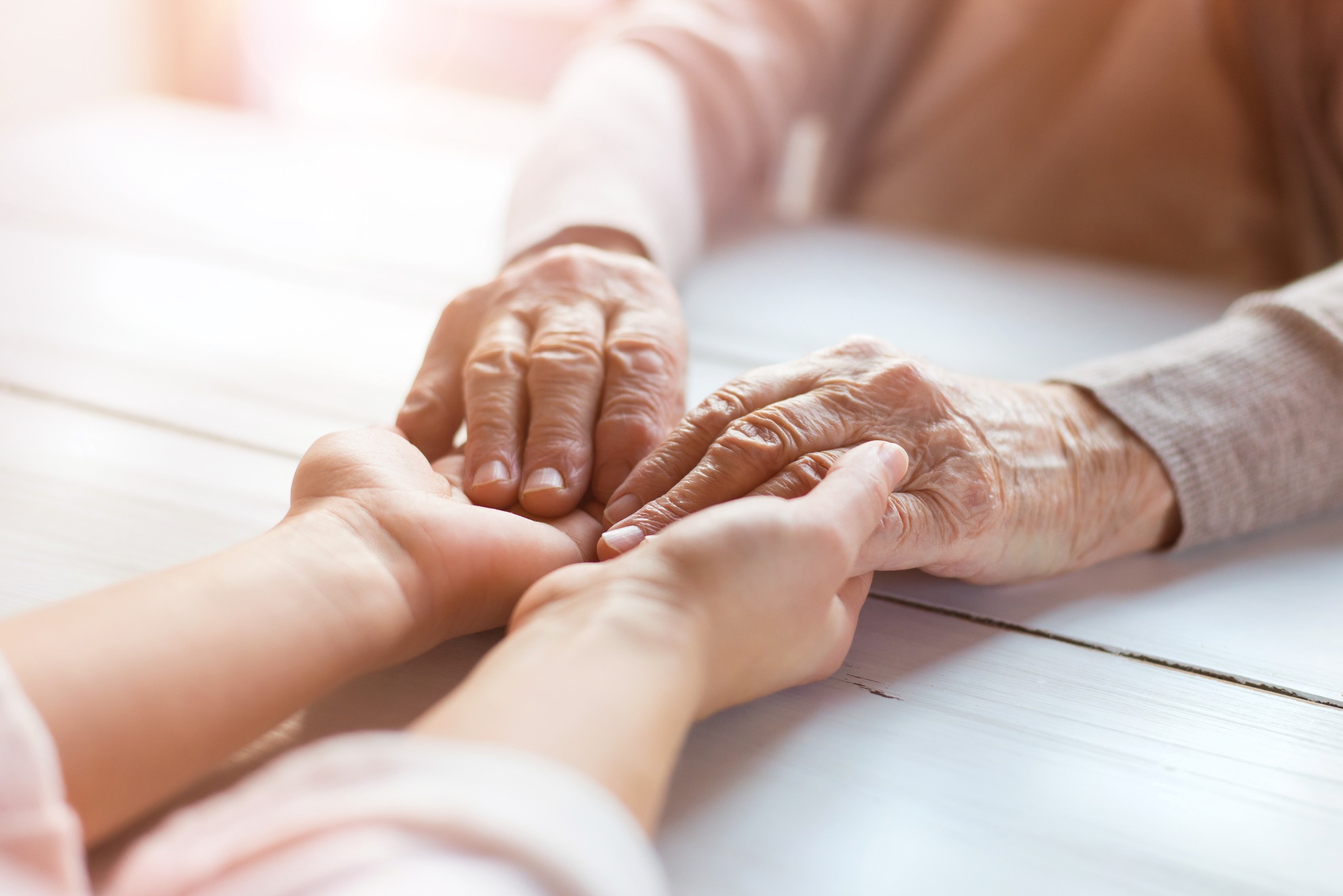 Grandmother and granddaughter holding hands