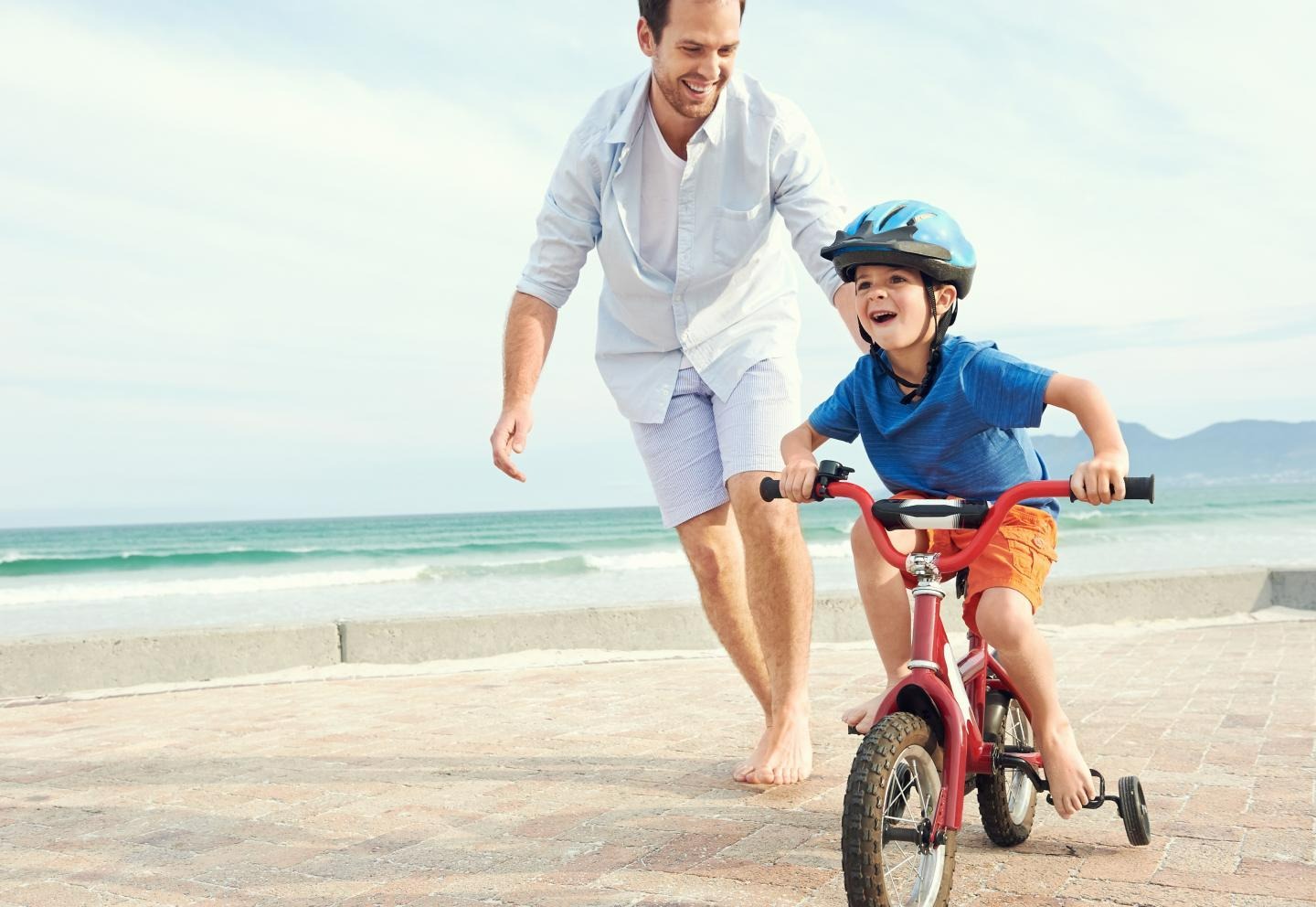 father and son on a beach
