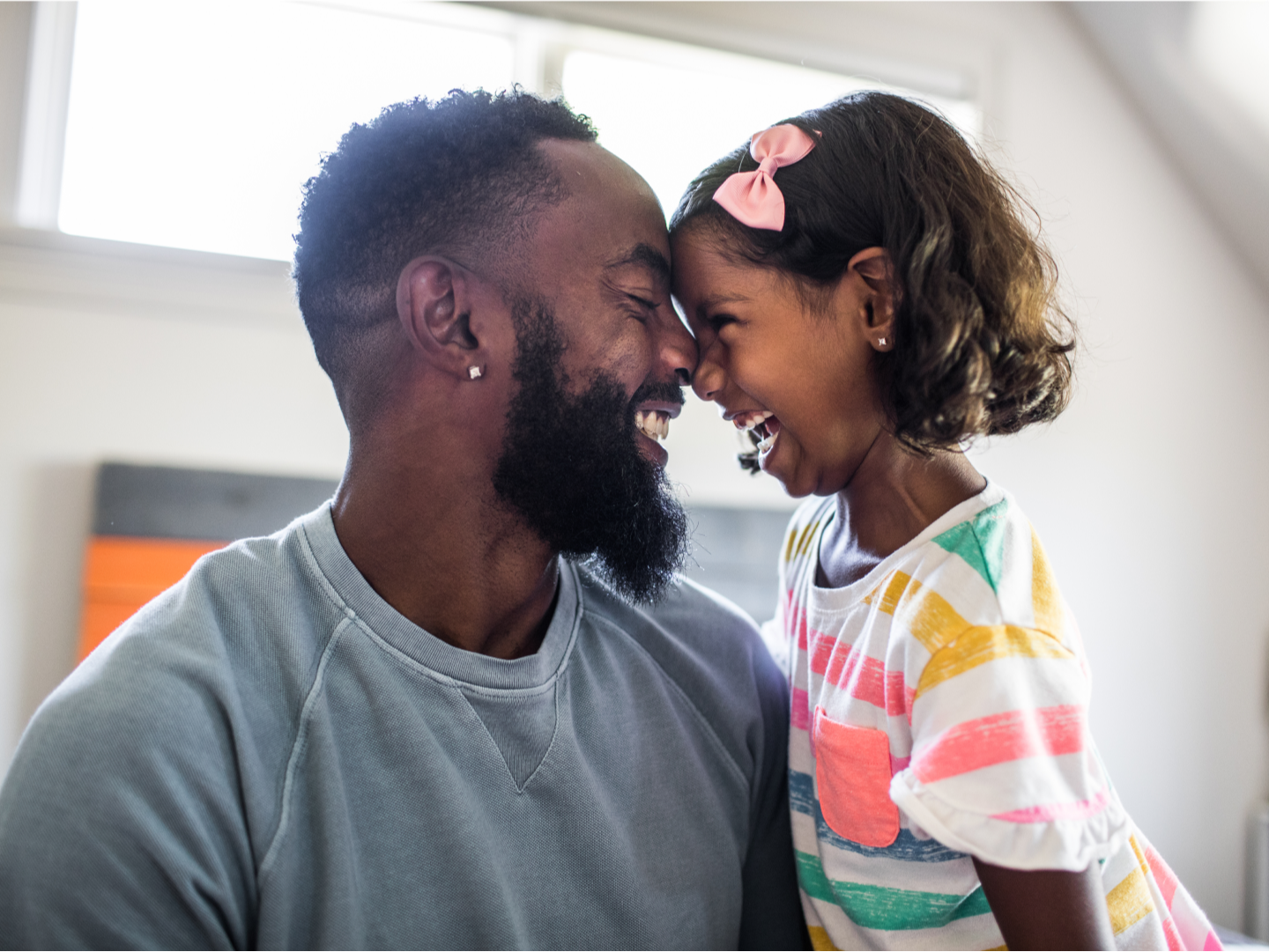 Father and daughter laughing together