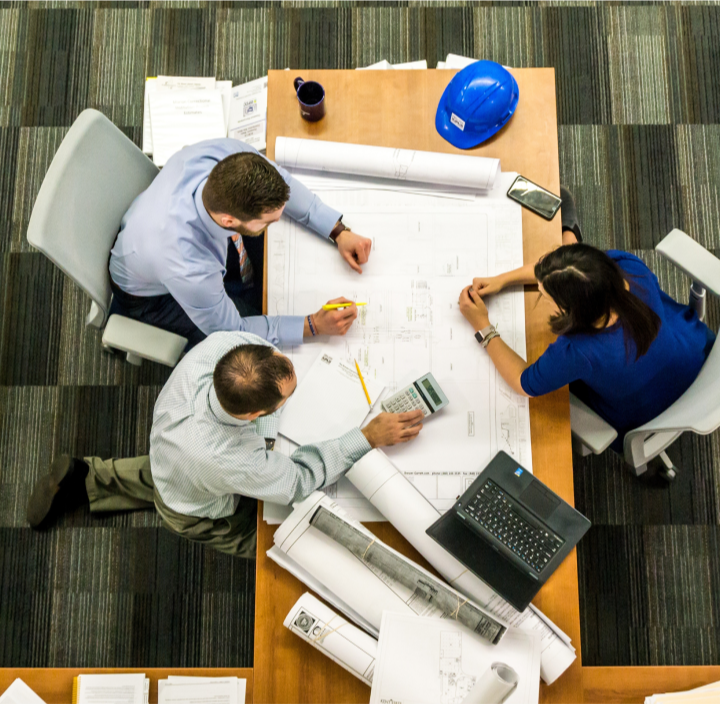 Three-coworkers-going-over-plans