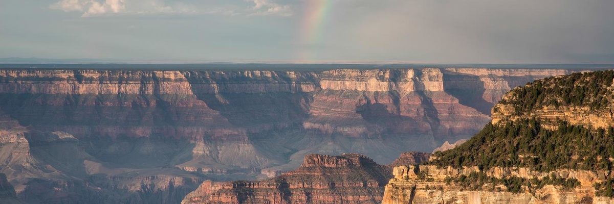 rainbow over a rocky canyon