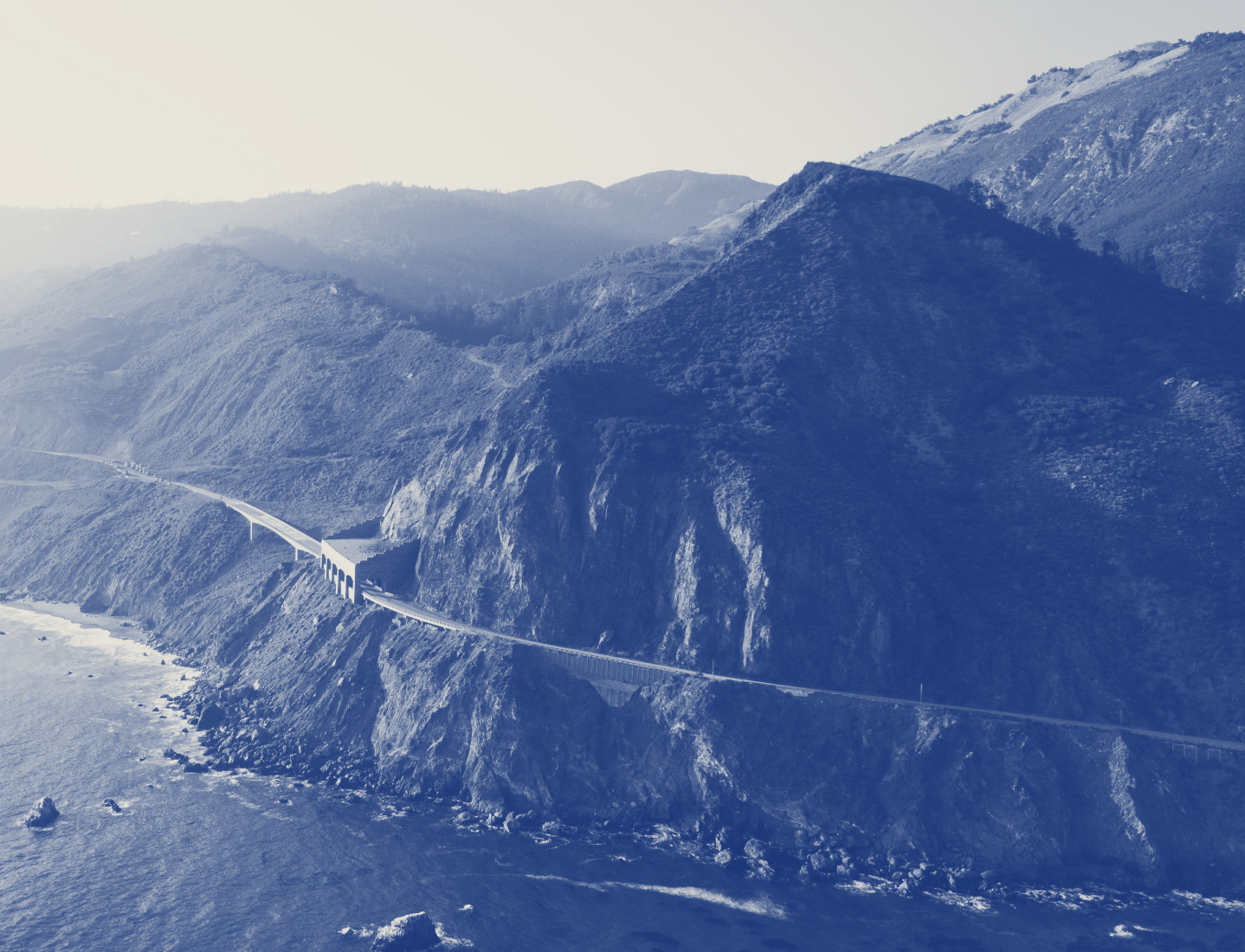 road on a cliff next to the ocean