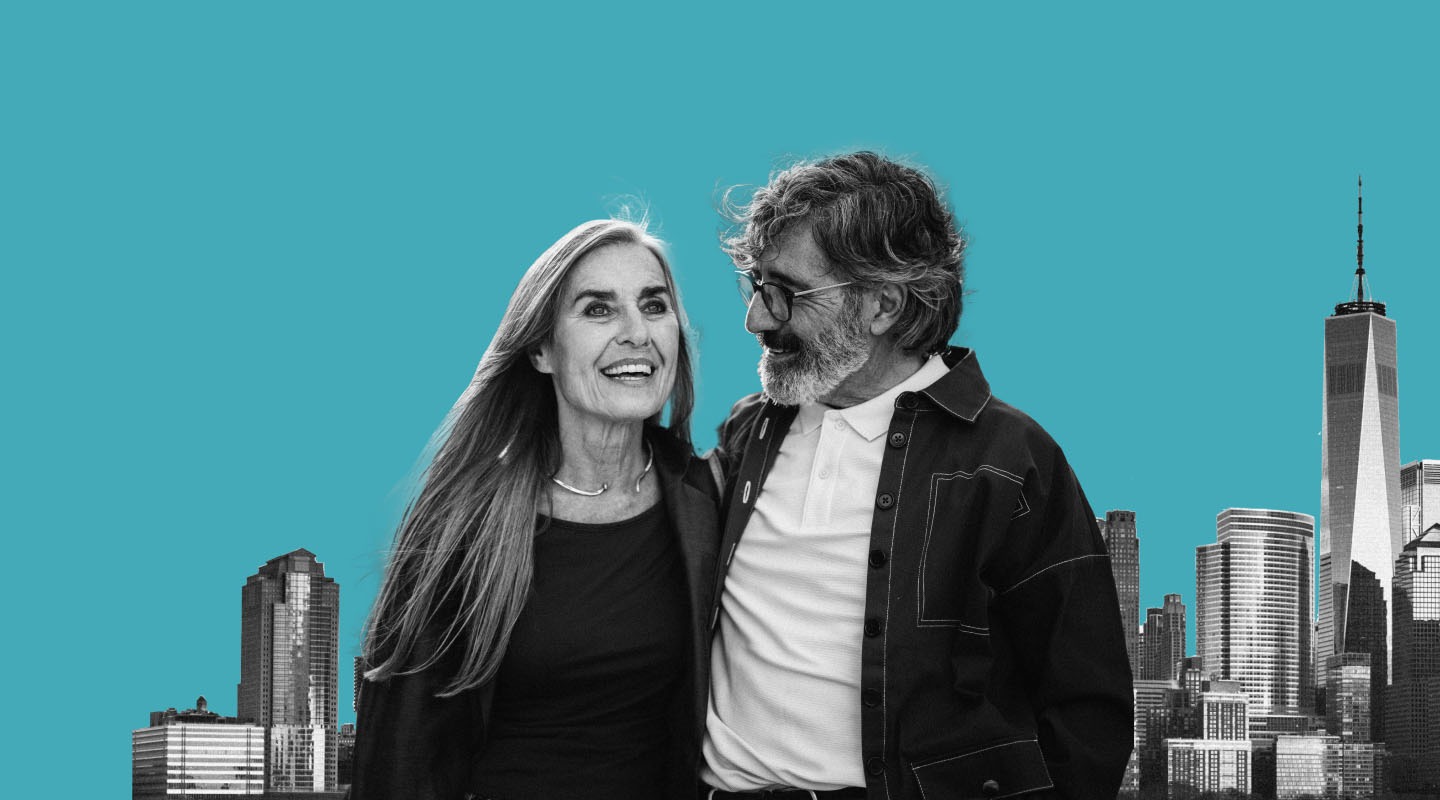 An elderly couple smiling together