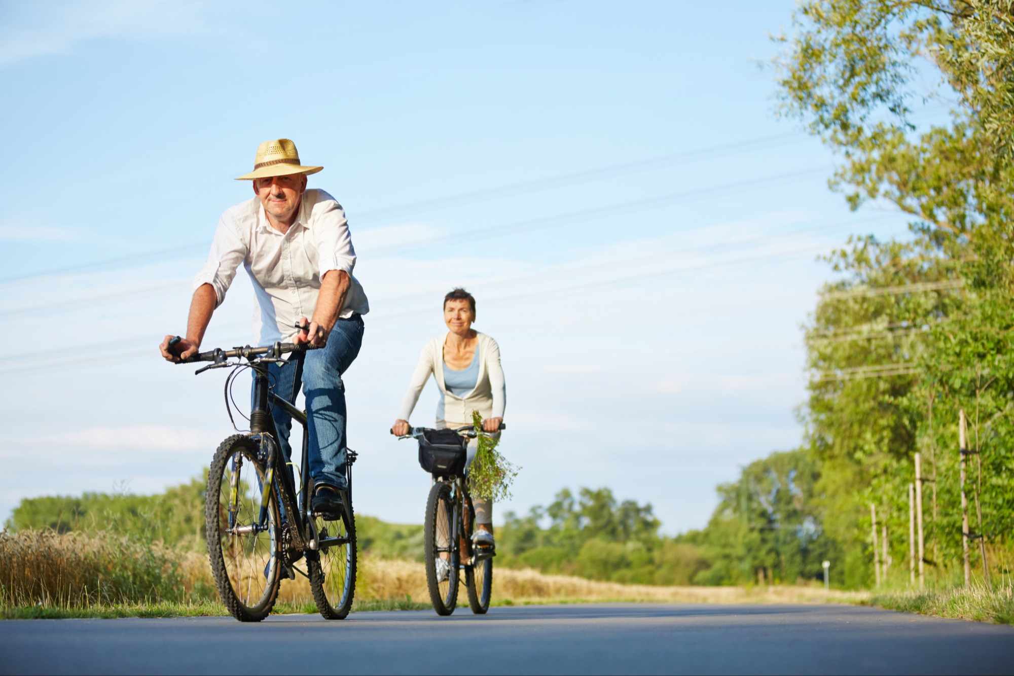 Couple riding bikes in the summer