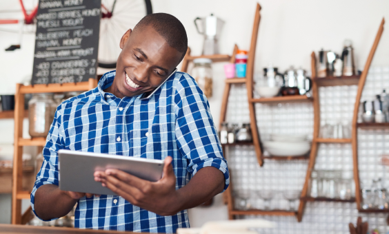 Person on the phone using a tablet