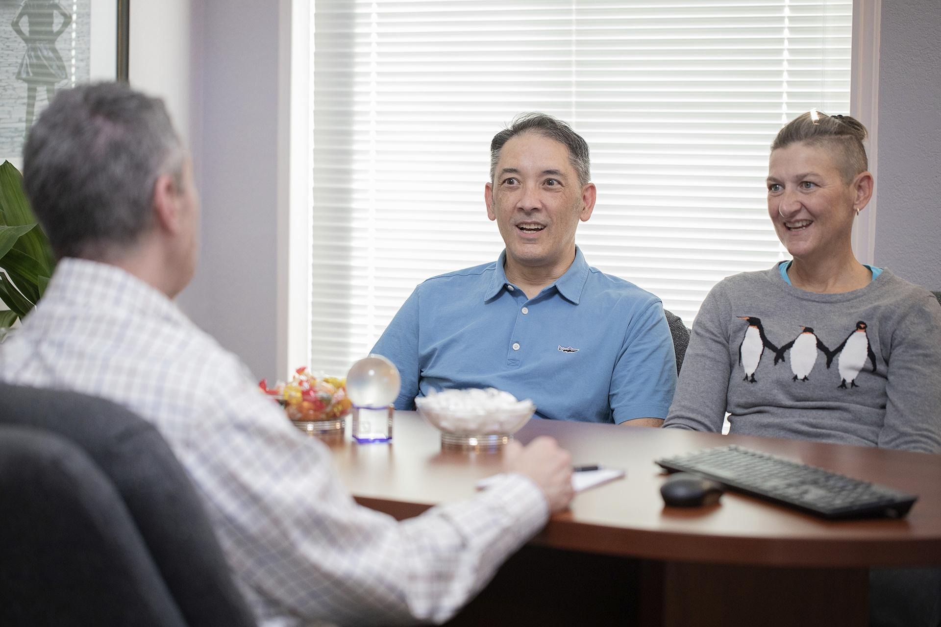 two people meeting with their financial advisor