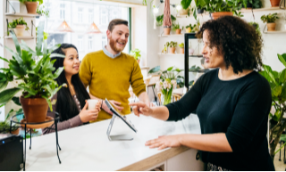 two-people-meeting-with-an-advisor-while-talking-over-a-desk