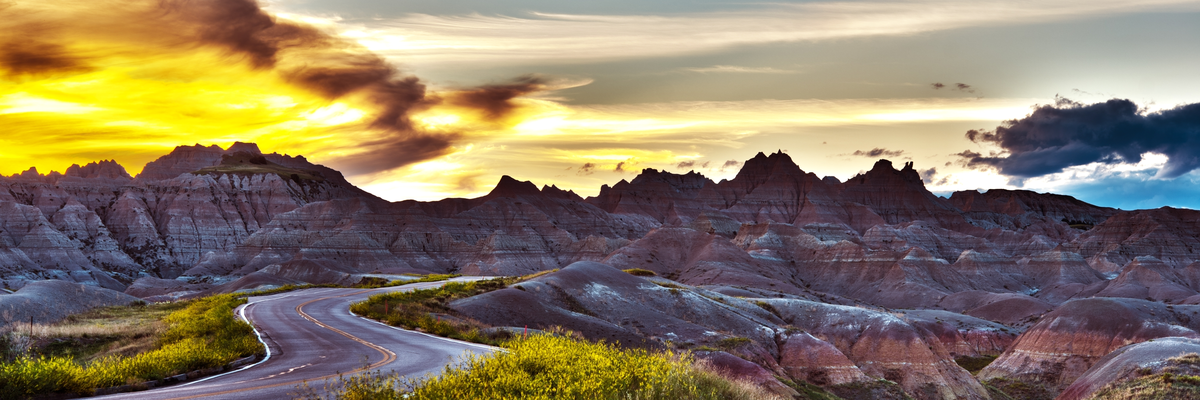 road winding through tall bare mountains