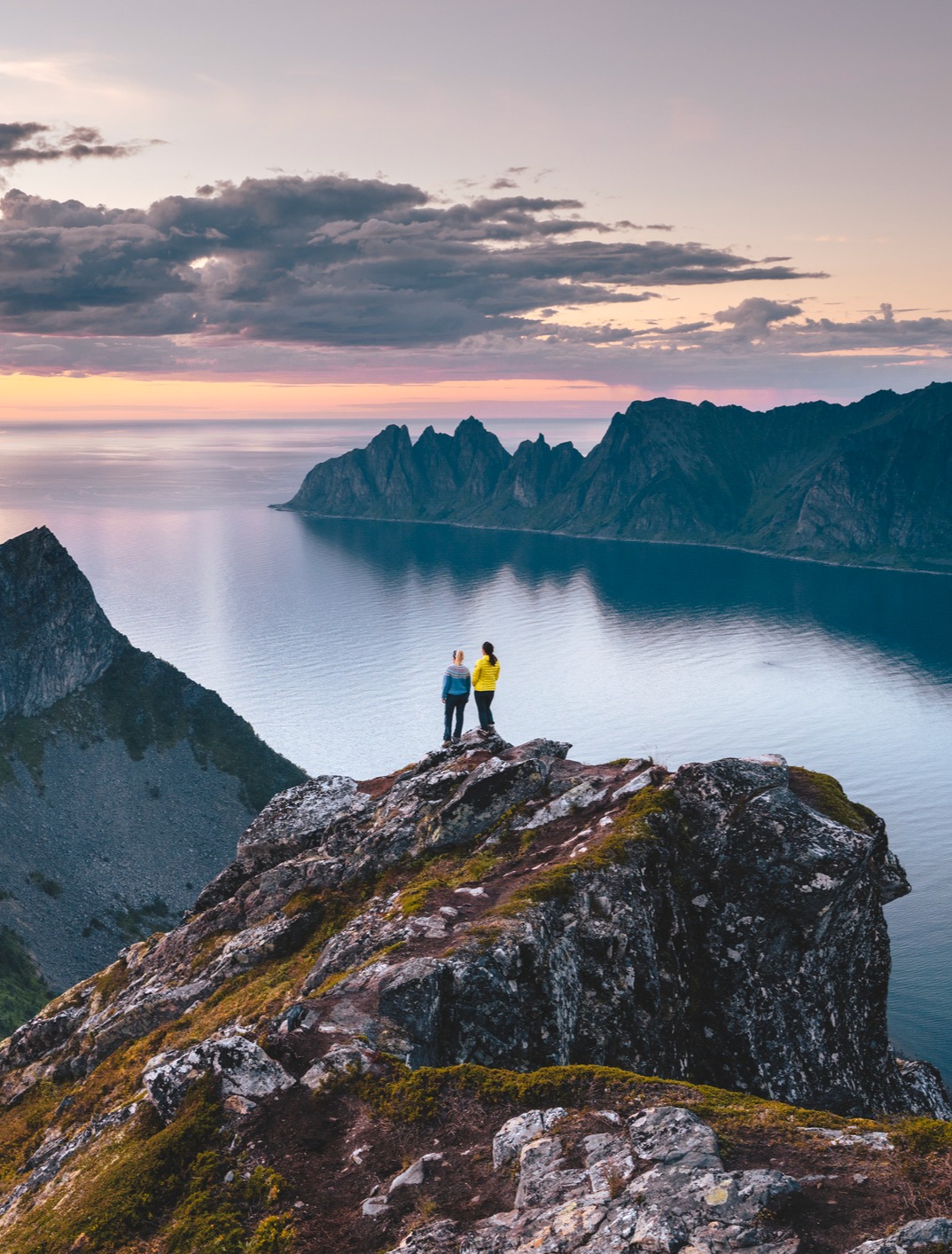 Two people at a mountaintop