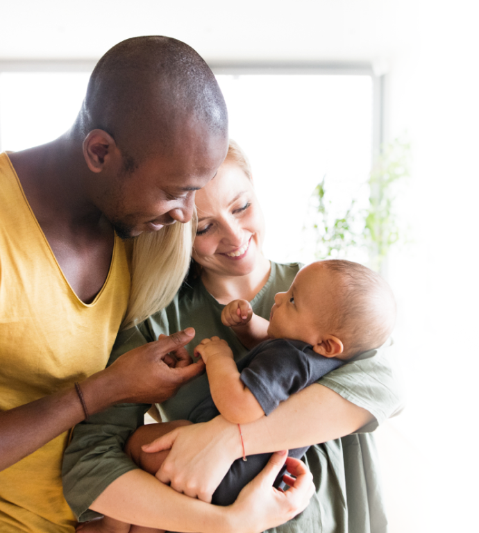 young couple holding a baby