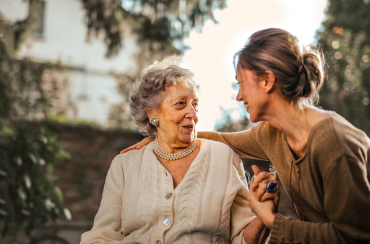 Woman-sitting-with-elderly-woman