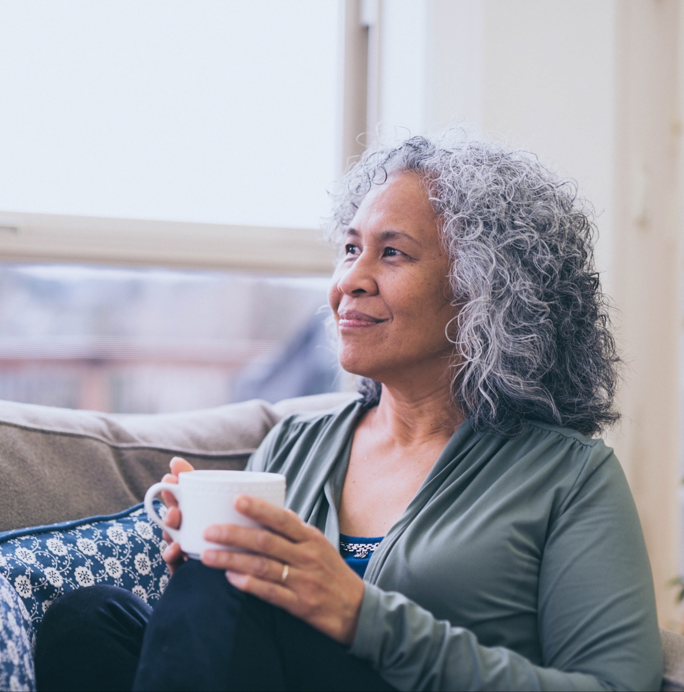 Mature woman enjoying coffee or tea