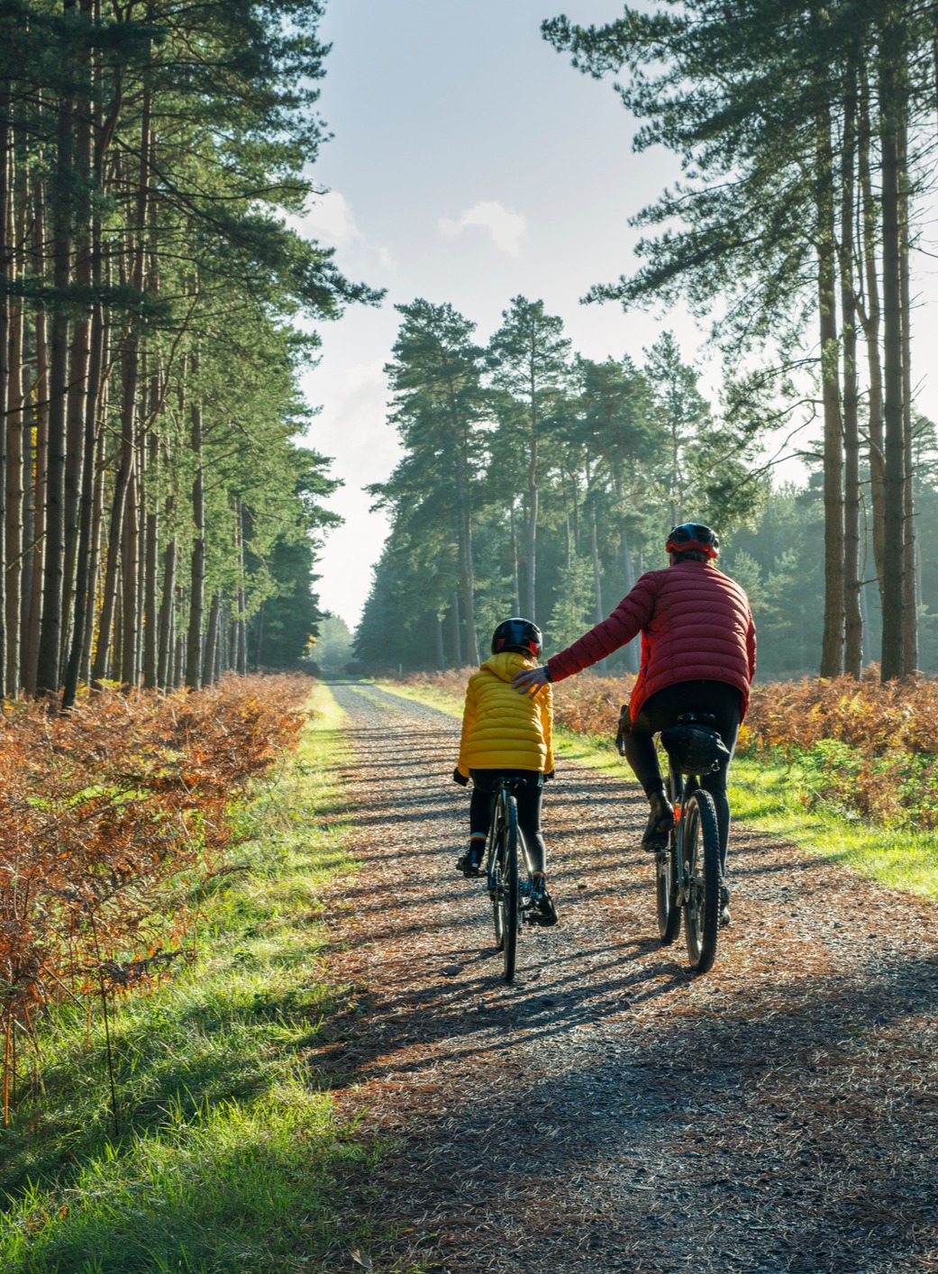 Father and Son biking on a gravel path