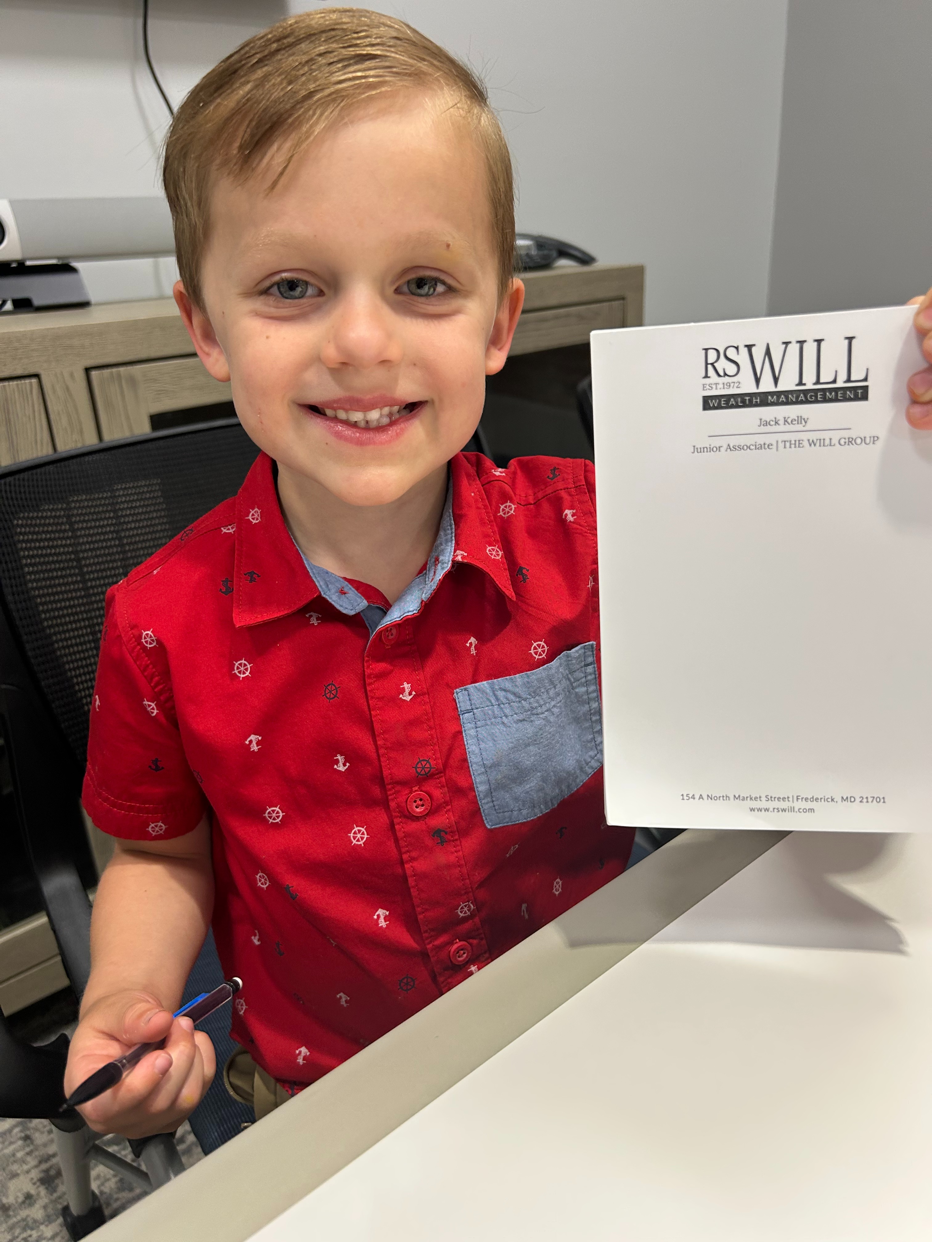 Jack showing off his personalized notepad