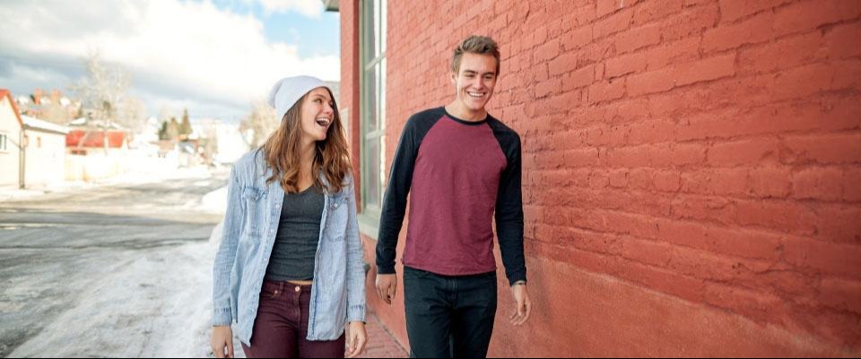 Man and woman walking and smiling