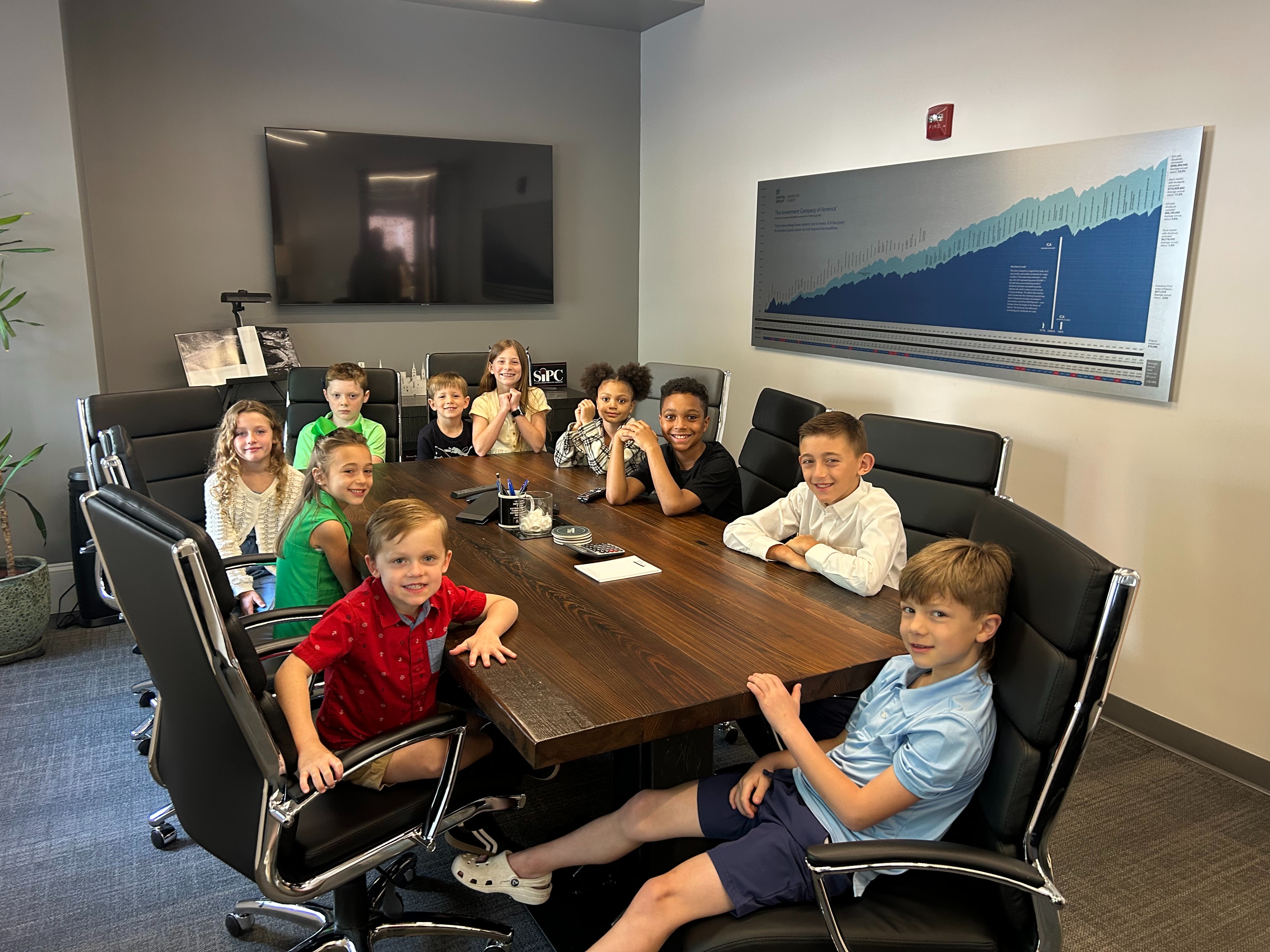 Will Group children holding a brief meeting