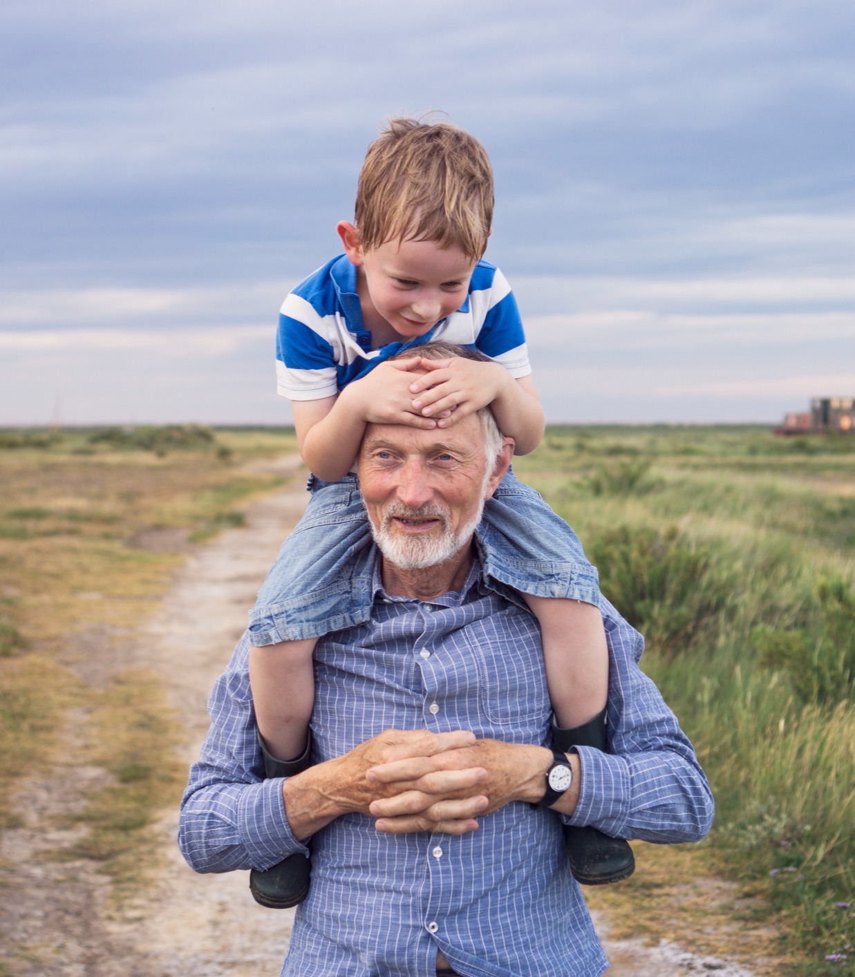 Older Man carrying child
