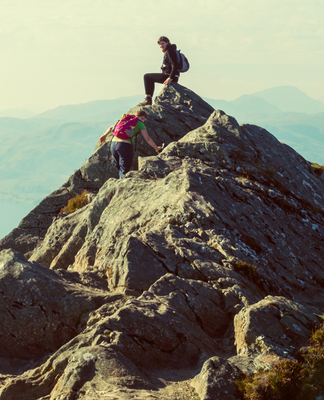 Mountain climbers at the peak of a mountain