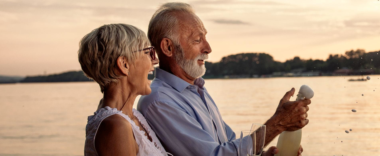 Beach - Couple celebrating