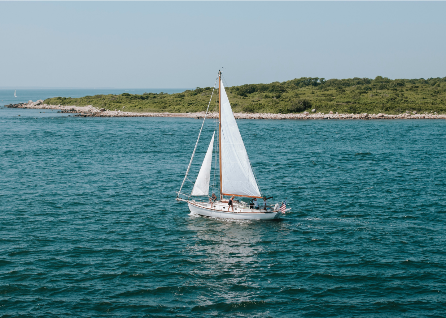 Sailboat-along-the-coastline.