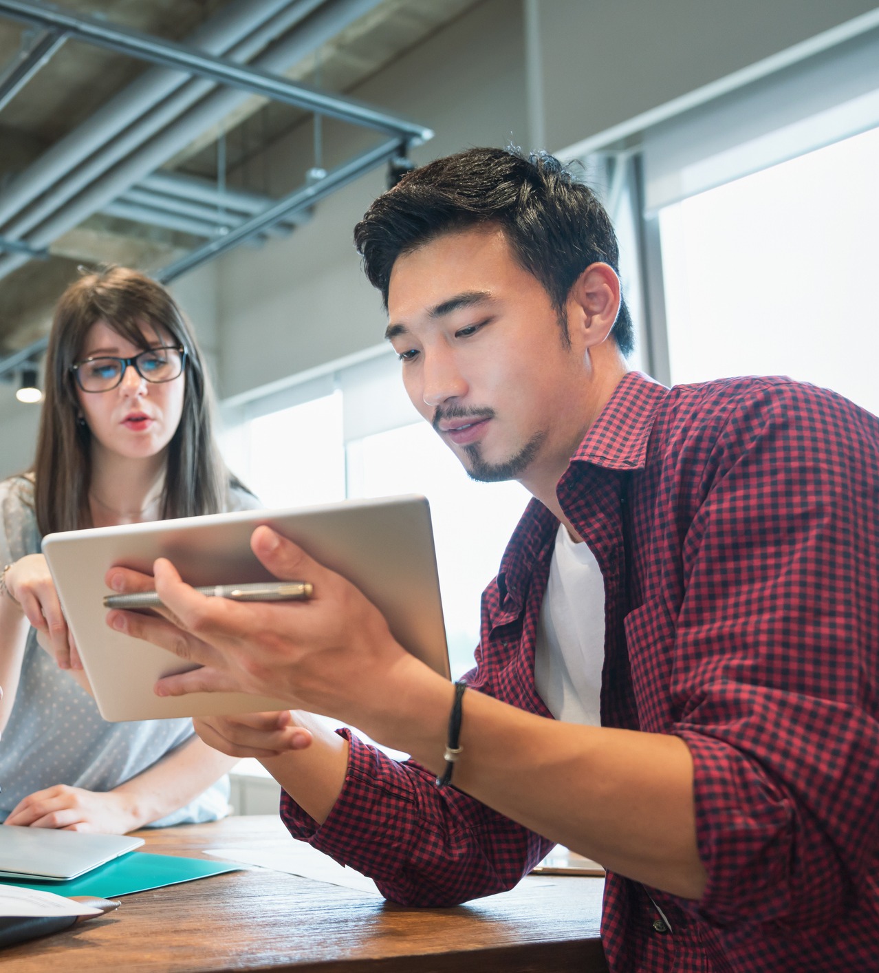 Millenials working on a tablet