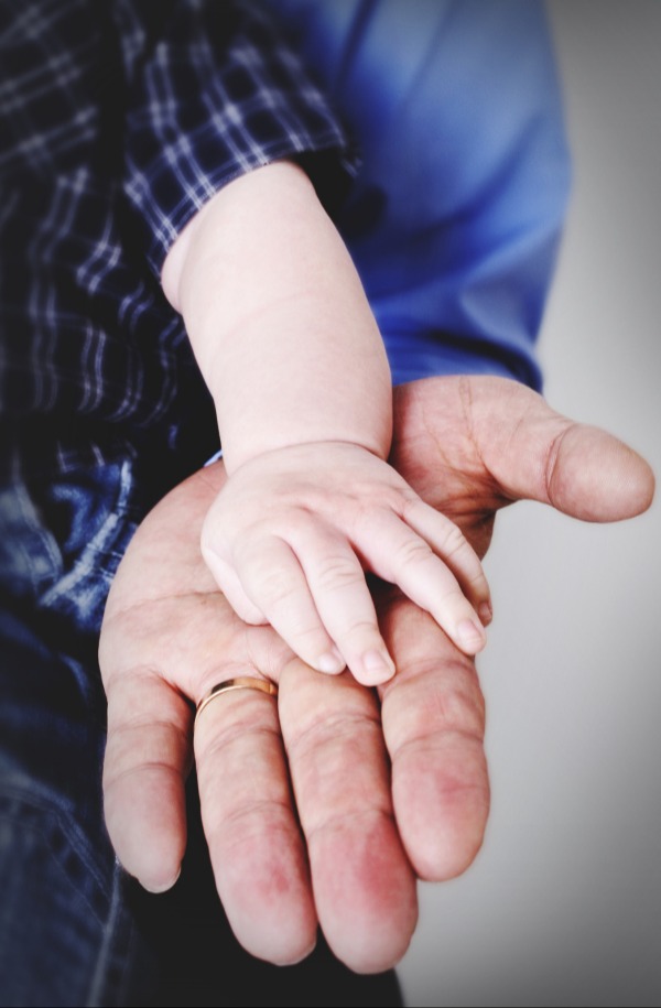 Old and young hand in hand