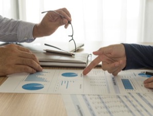 Colleagues collaborating on a business plan.