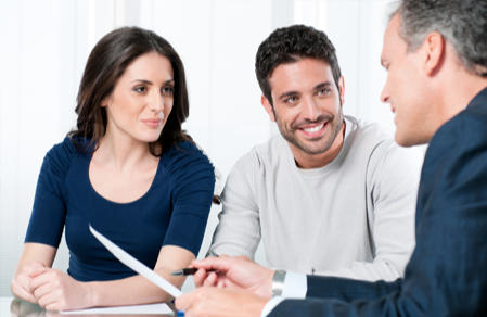 Younger couple meeting with an advisor